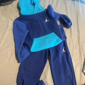 Jordan Teal Apparel with Blue Logo